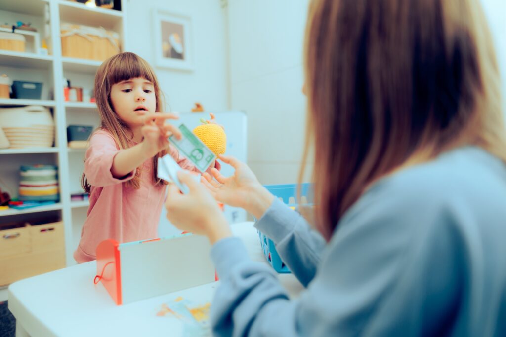 2nd grade girl playing with money