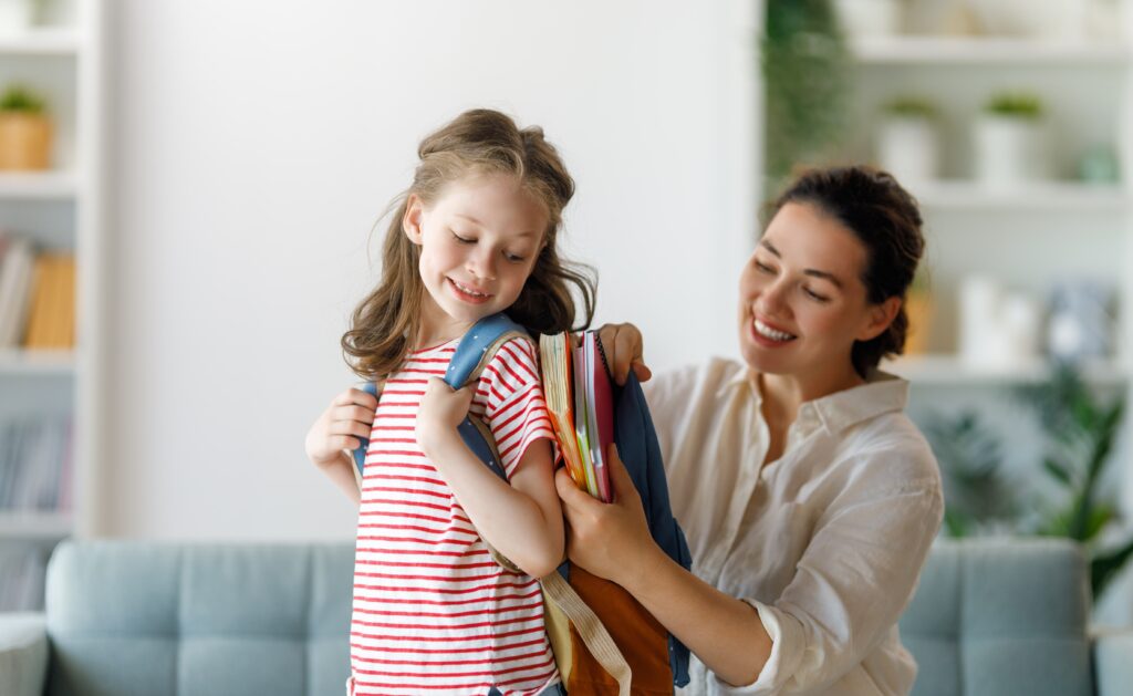 girl and mom preparing for school